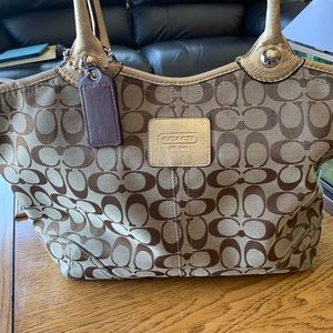 Coach Purse Gold accents.